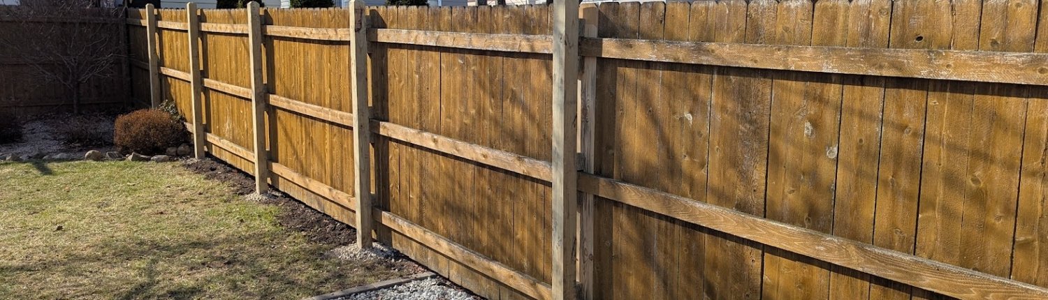 newly repaired fence after high wind and storm damage