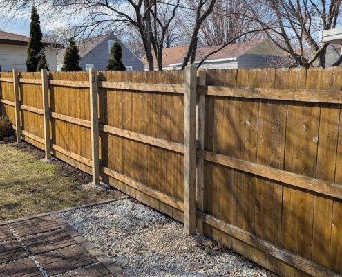newly repaired fence after high wind and storm damage