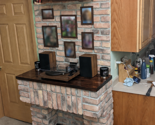 Finished ventless fireplace with brick veneer