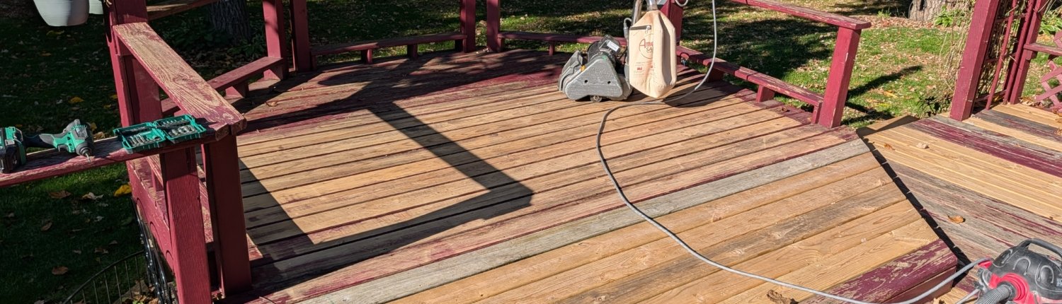 Deck sanding Commercial deck sanding equipment removing old stain and paint from outdoor wooden boards